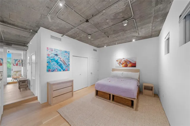 a bedroom with furniture and a baby crib