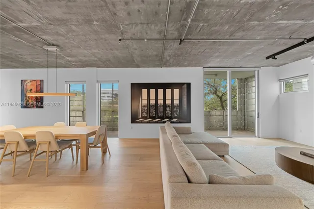 a living room with furniture and window