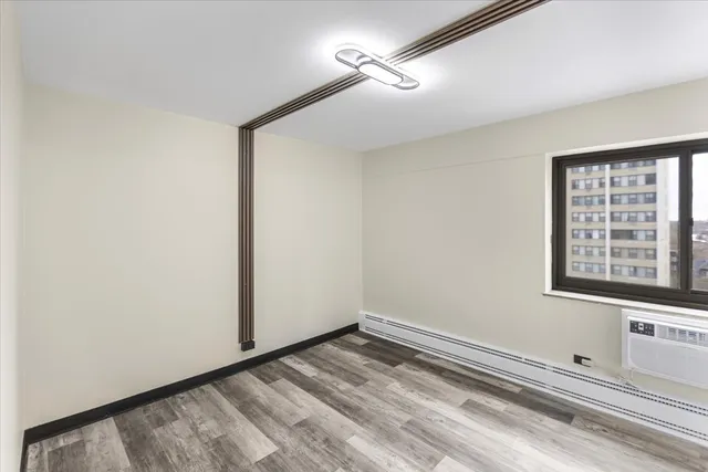 a view of an empty room with a window