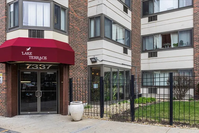 a front view of a building with a glass door