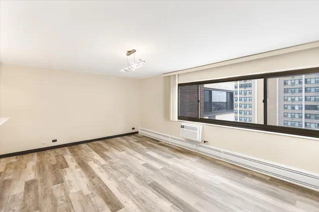 a view of an empty room with a window