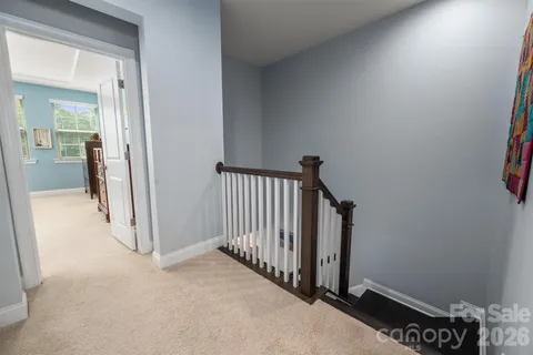 a view of a hallway and interior of the house
