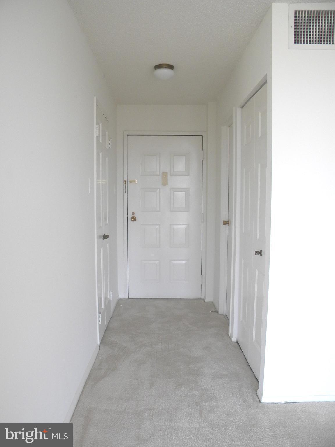 6800 Fleetwood Road, Unit 421 McLean, VA 22101 - Photo 2 of 24 Entrance foyer showing Front Door and Hall