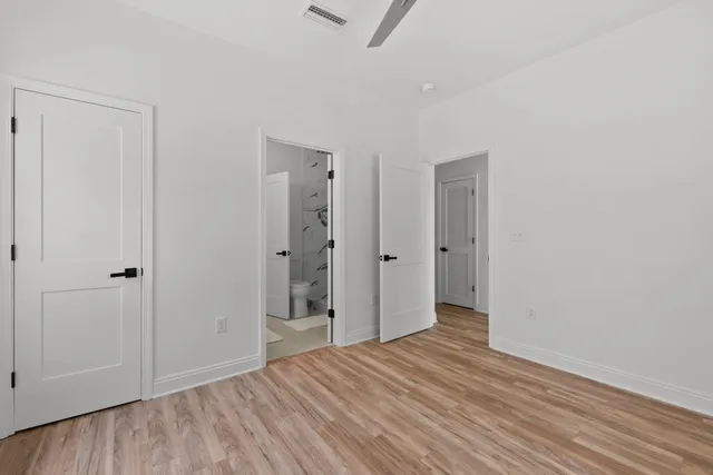 a view of hallway with wooden floor