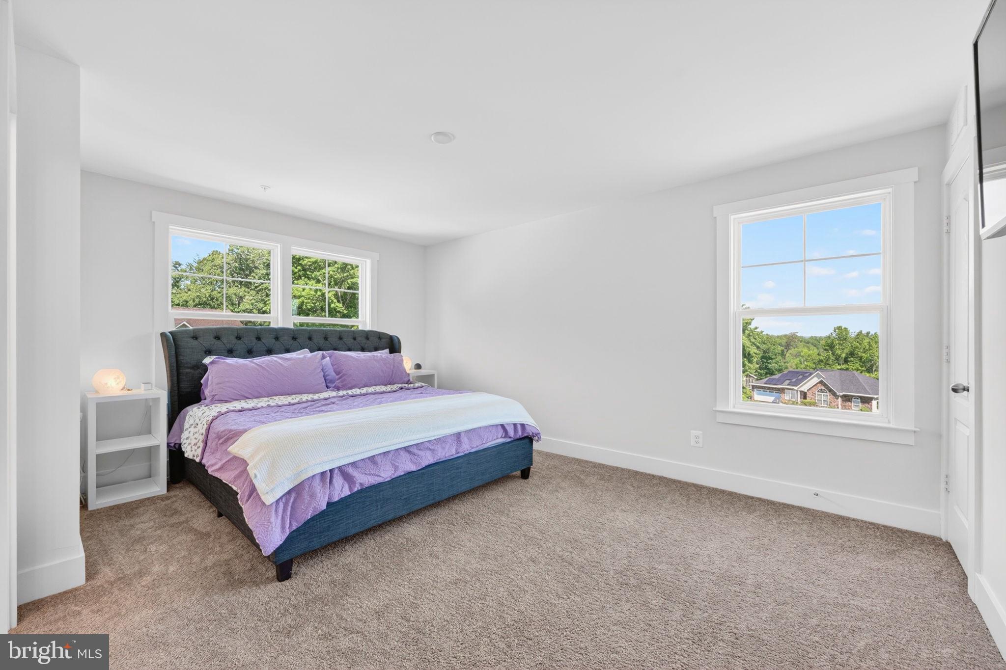 30 Range Road North East, MD 21901 - Photo 46 of 73 a spacious bedroom with a bed lamp and window