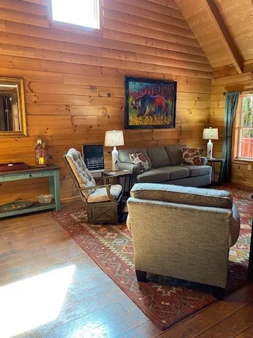 a view of a two chairs in the balcony