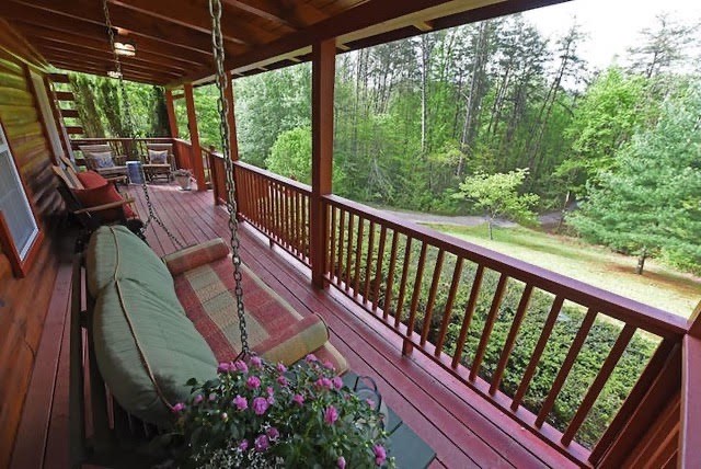 360 Johnson Cove Road Copperhill, TN 37317 - Photo 19 of 56 a view of a two chairs in the balcony