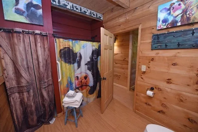 a bathroom with a sink a bath tub and shower