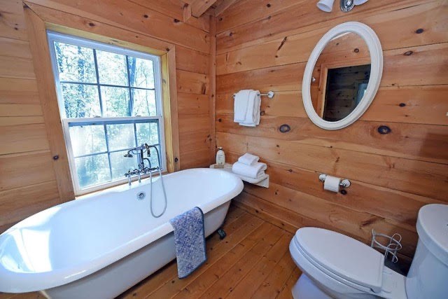 360 Johnson Cove Road Copperhill, TN 37317 - Photo 25 of 56 a bathroom with a sink mirror vanity and toilet