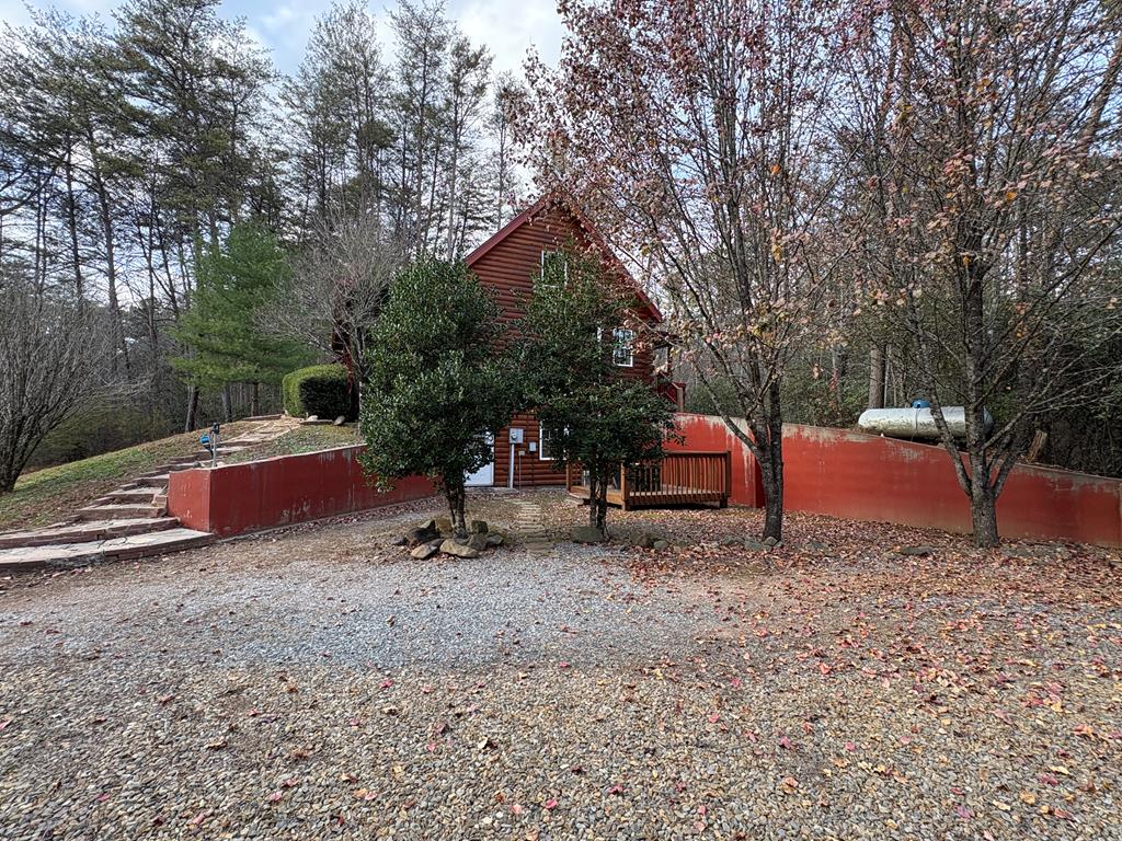 360 Johnson Cove Road Copperhill, TN 37317 - Photo 29 of 56 a backyard of a house with table and chairs