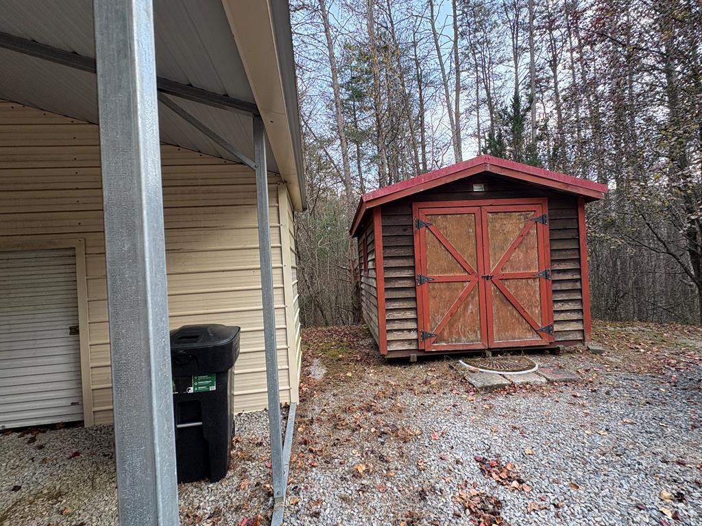 360 Johnson Cove Road Copperhill, TN 37317 - Photo 30 of 56 a front view of a house with a yard