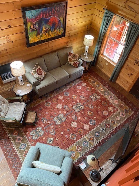 360 Johnson Cove Road Copperhill, TN 37317 - Photo 3 of 56 a living room with furniture and a rug