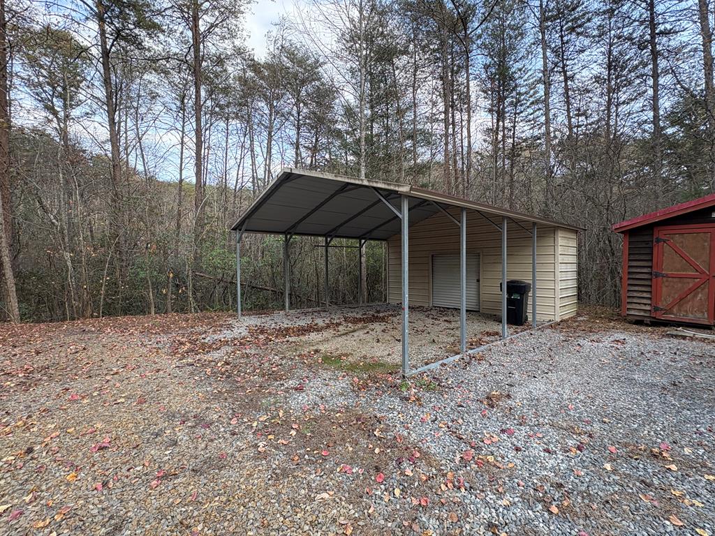360 Johnson Cove Road Copperhill, TN 37317 - Photo 31 of 56 a backyard of a house with table and chairs