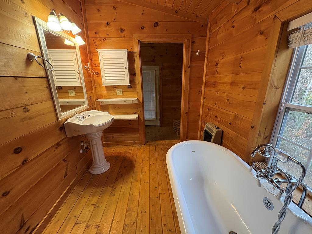 360 Johnson Cove Road Copperhill, TN 37317 - Photo 40 of 56 a bathroom with a sink and mirror