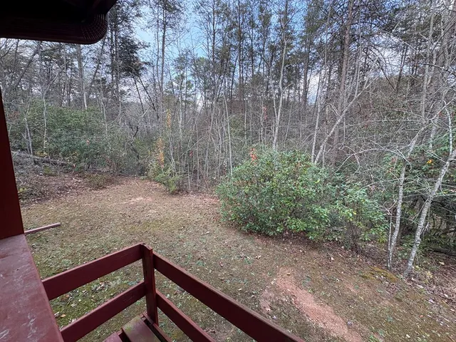a bathroom with a sink toilet and window