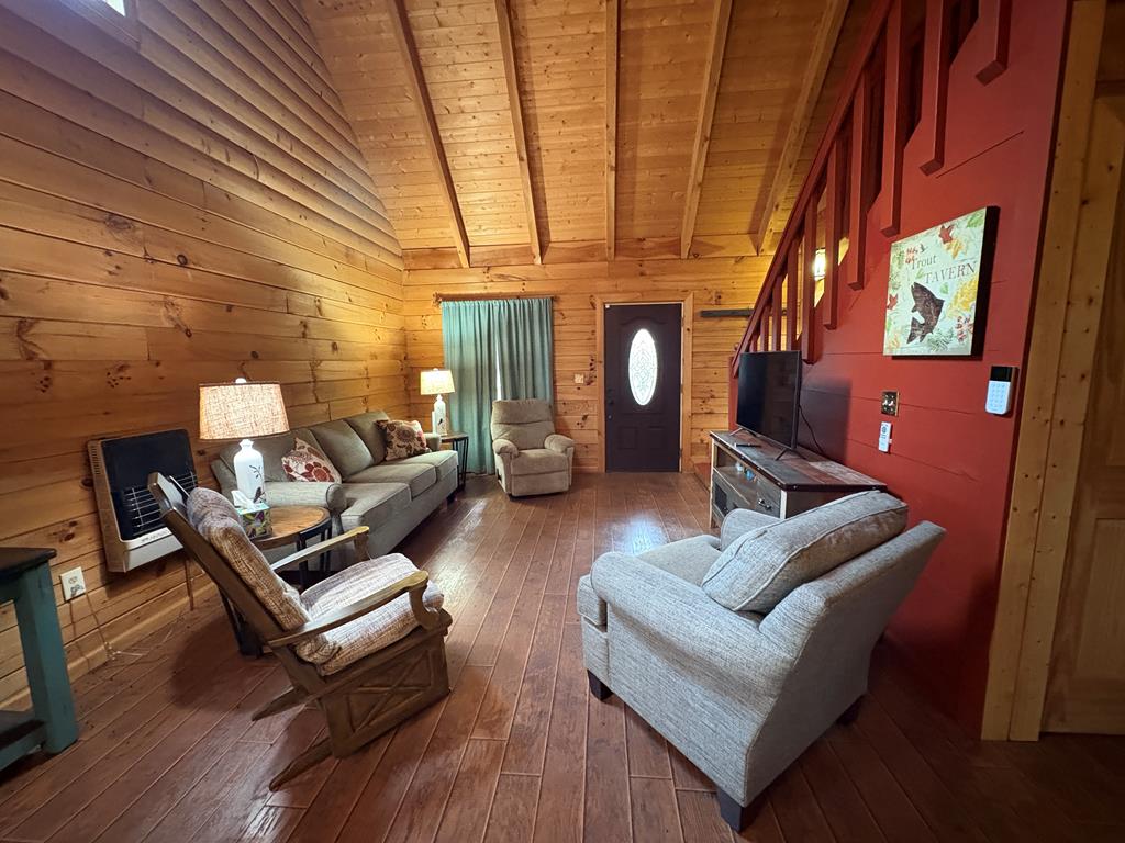 360 Johnson Cove Road Copperhill, TN 37317 - Photo 45 of 56 a living room with furniture and a fireplace
