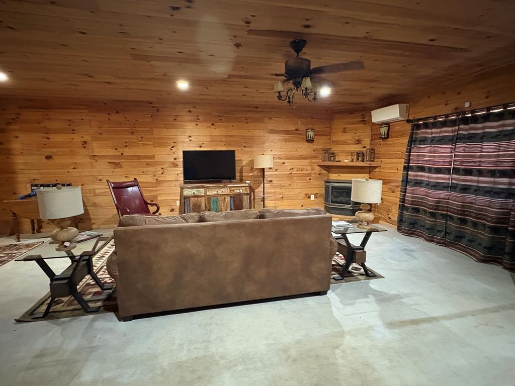 360 Johnson Cove Road Copperhill, TN 37317 - Photo 49 of 56 a room with furniture and a flat screen tv