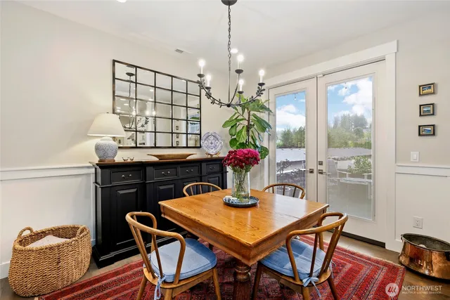 a view of a dining room with furniture and window
