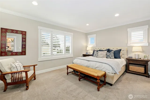 a spacious bedroom with a bed and a couch