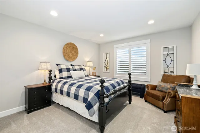 a bedroom with bed and a window