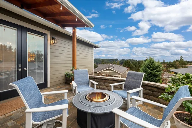 a view of a patio with table and chairs and potted plants