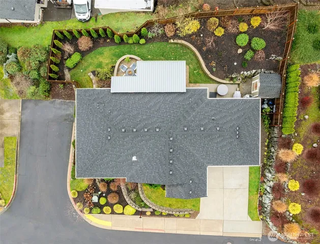 view of a wooden table and chairs in front of house