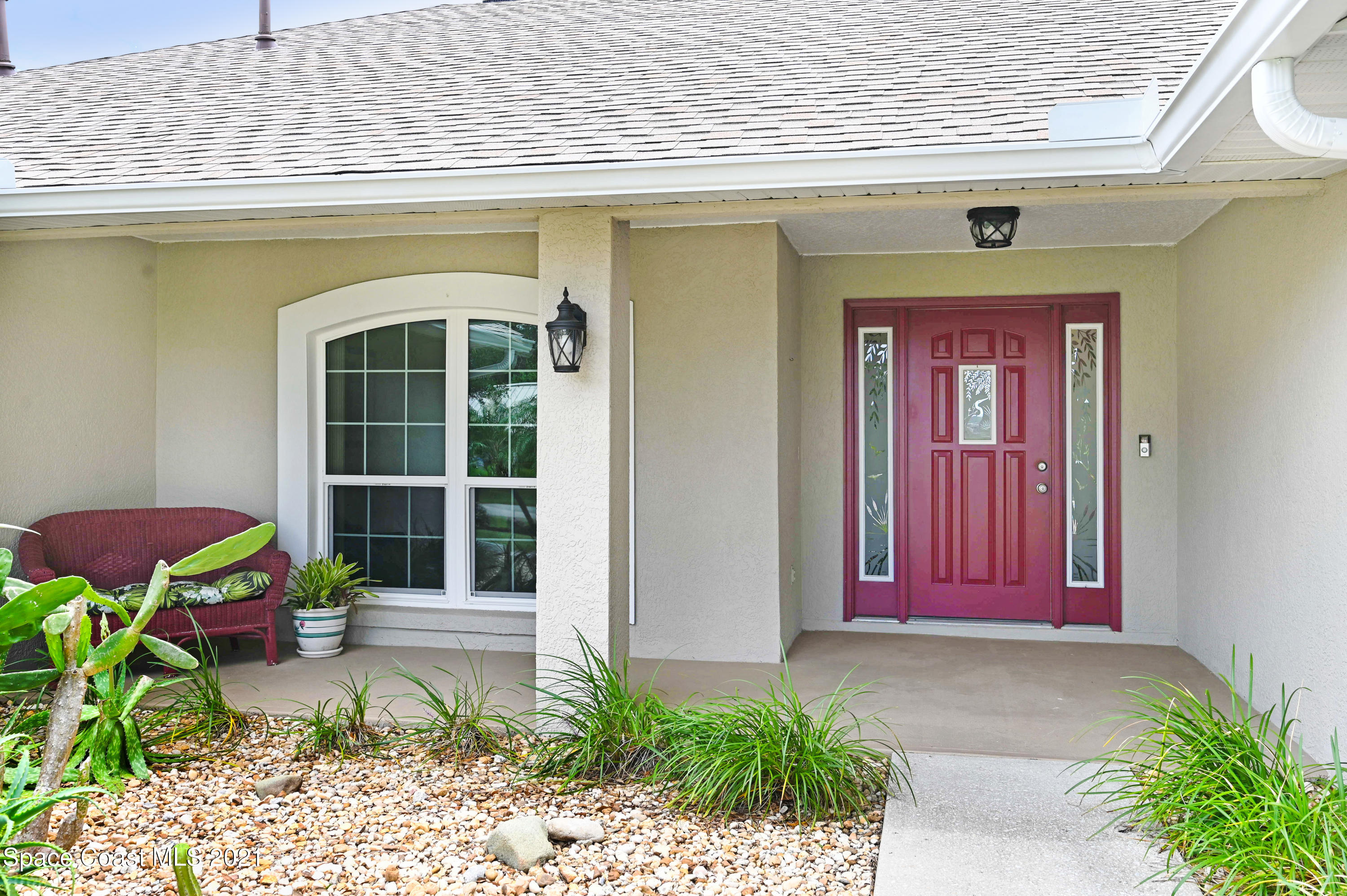 4689 Canard Road Melbourne, FL 32934 - Photo 2 of 49 a front view of a house with a yard