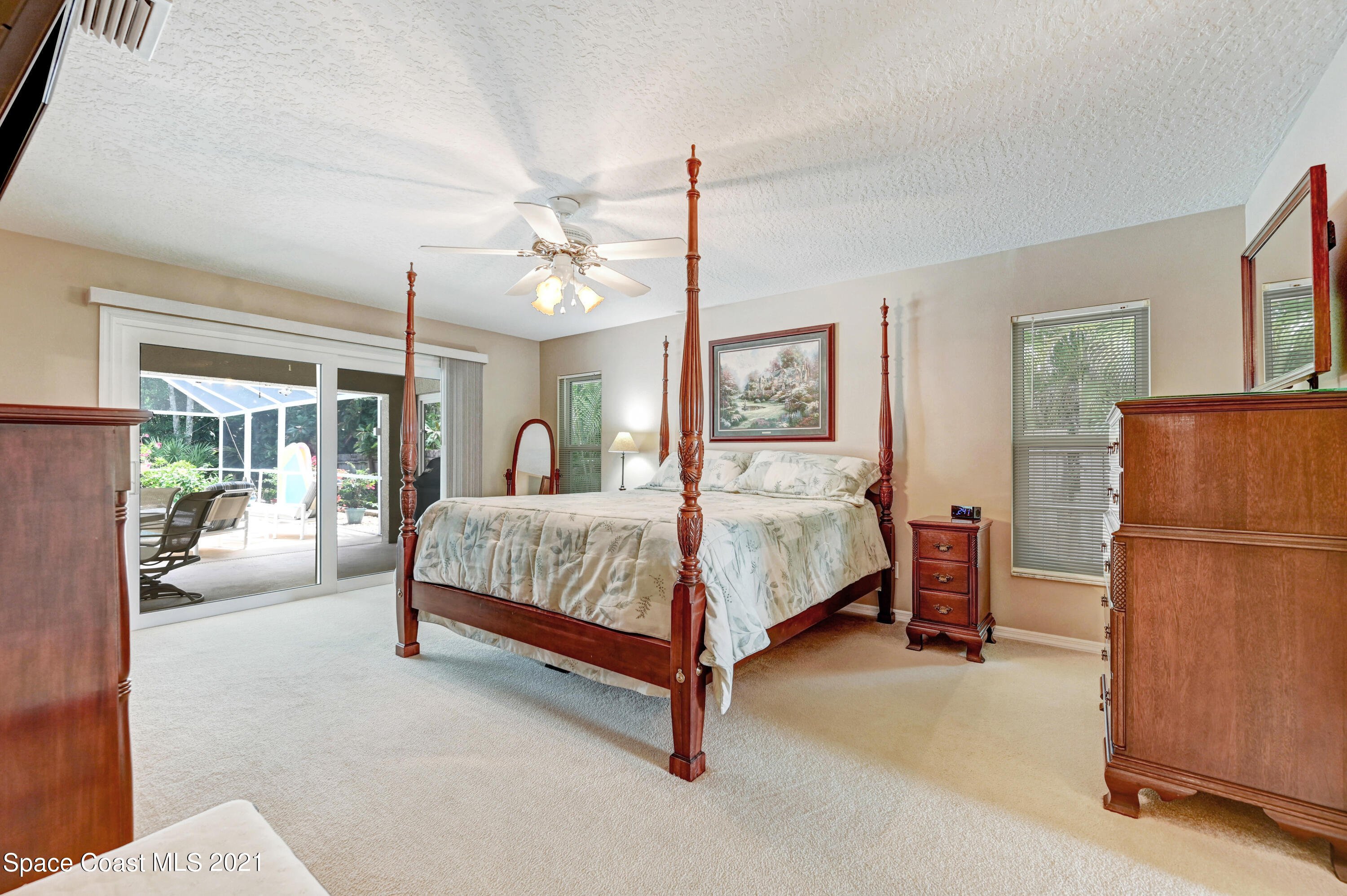 4689 Canard Road Melbourne, FL 32934 - Photo 11 of 49 a bedroom with a bed couch and window