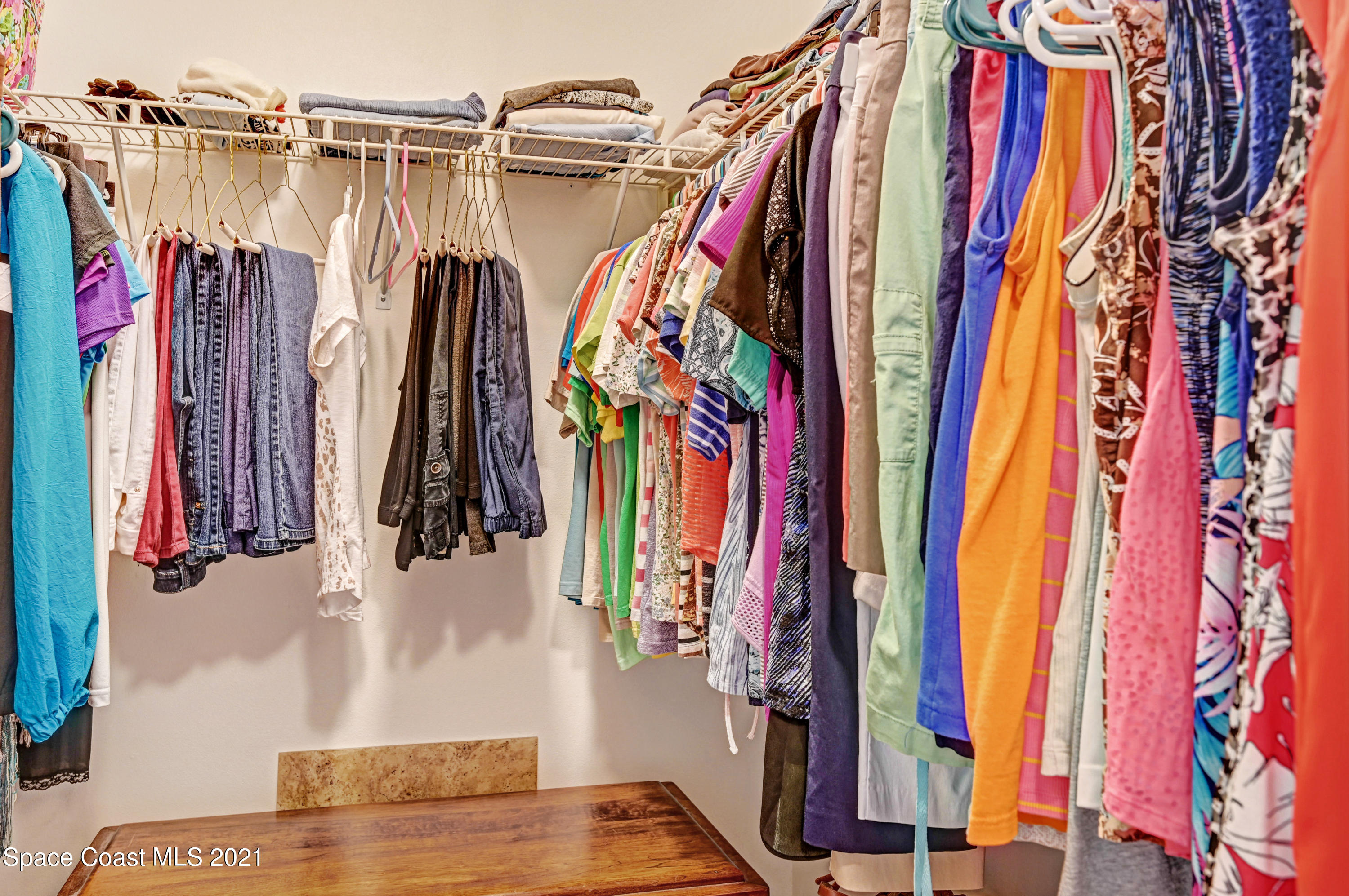 4689 Canard Road Melbourne, FL 32934 - Photo 13 of 49 a view of walk in closet with clothes