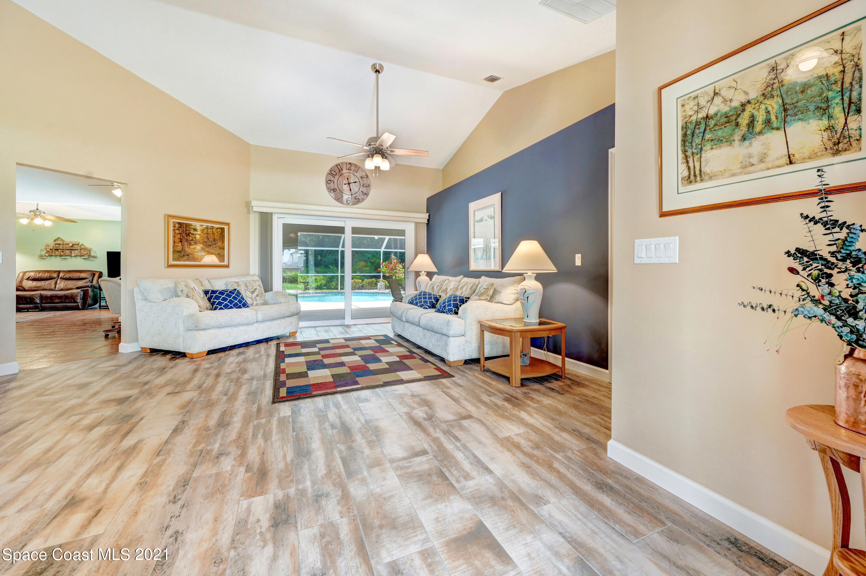 4689 Canard Road Melbourne, FL 32934 - Photo 3 of 49 a living room with furniture and a table