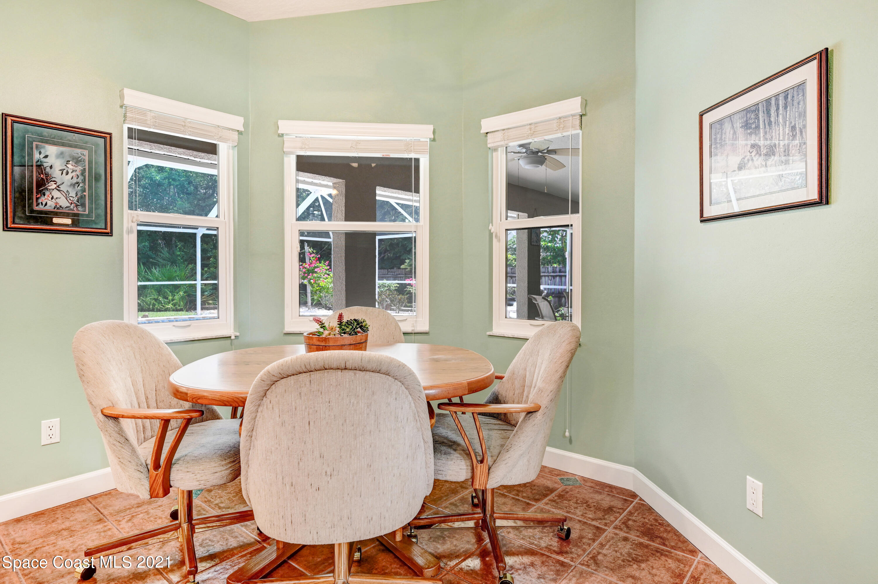 4689 Canard Road Melbourne, FL 32934 - Photo 24 of 49 a dining room with furniture and window