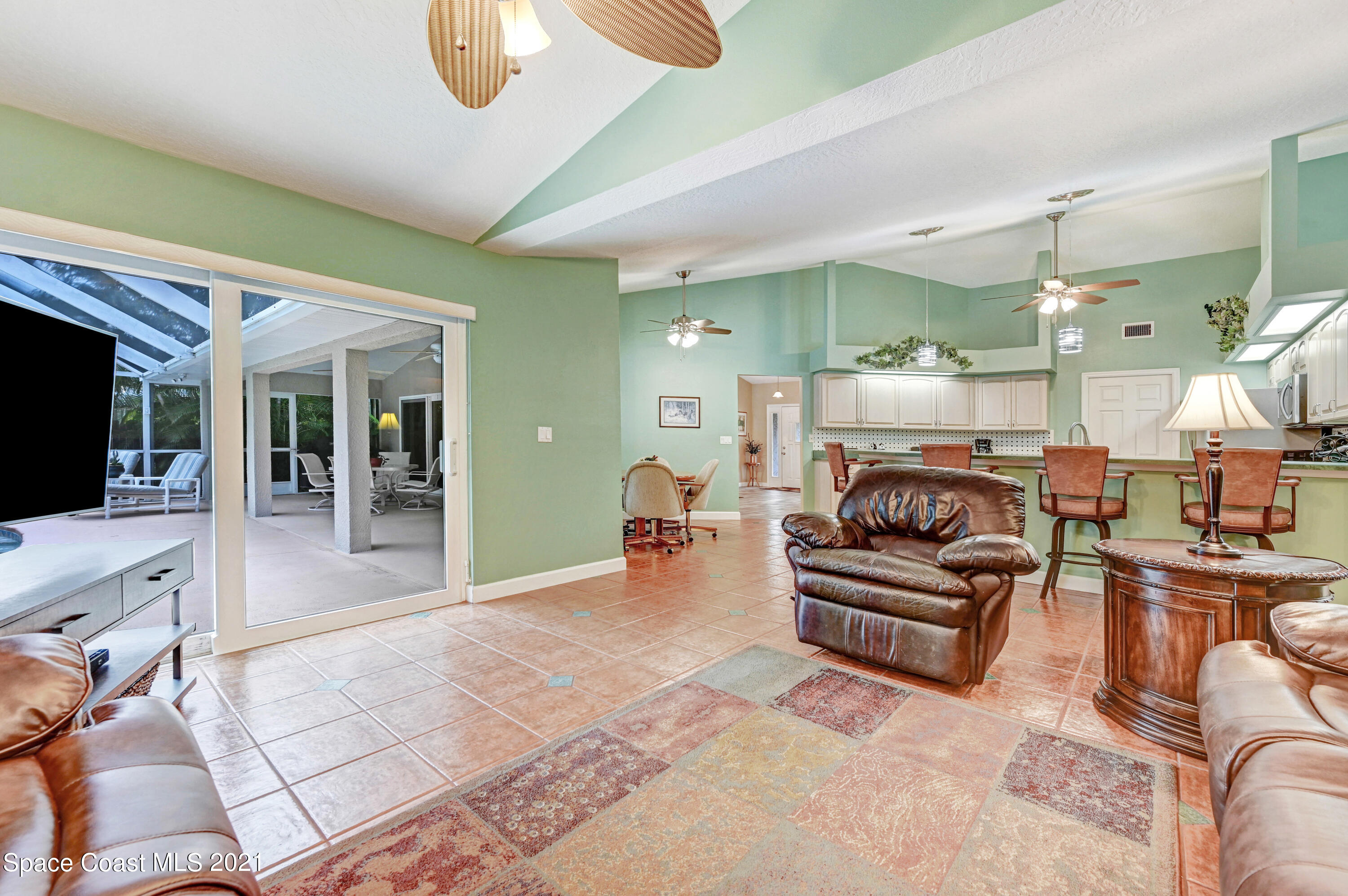 4689 Canard Road Melbourne, FL 32934 - Photo 28 of 49 a living room with furniture and a fireplace