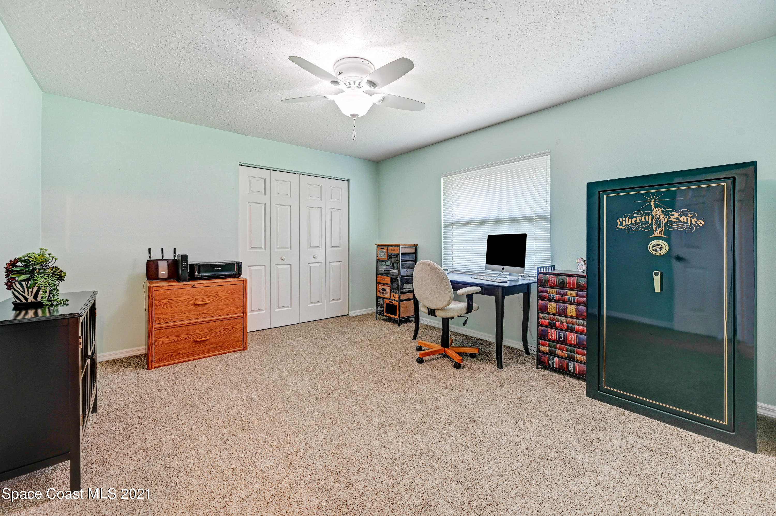 4689 Canard Road Melbourne, FL 32934 - Photo 31 of 49 a view of workspace with furniture and a ceiling fan