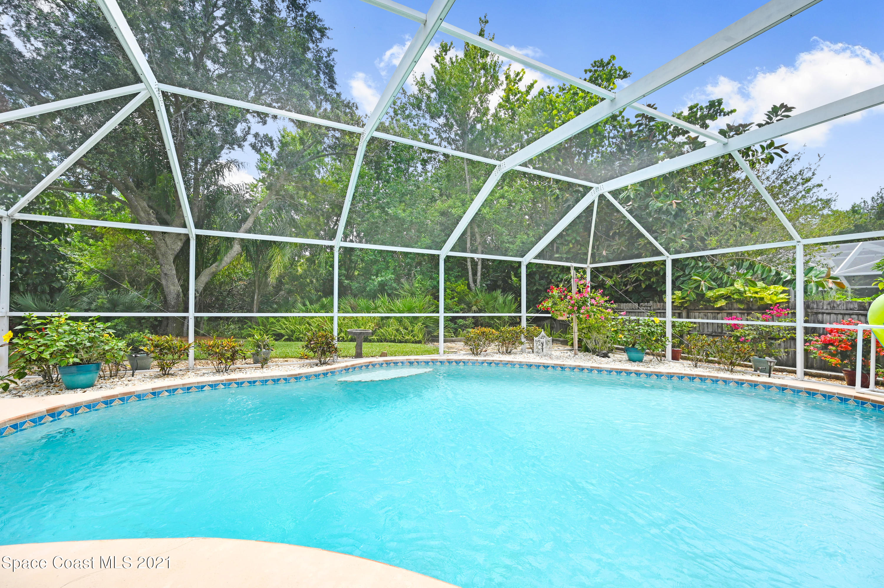 4689 Canard Road Melbourne, FL 32934 - Photo 34 of 49 a view of an empty room with floor to ceiling windows