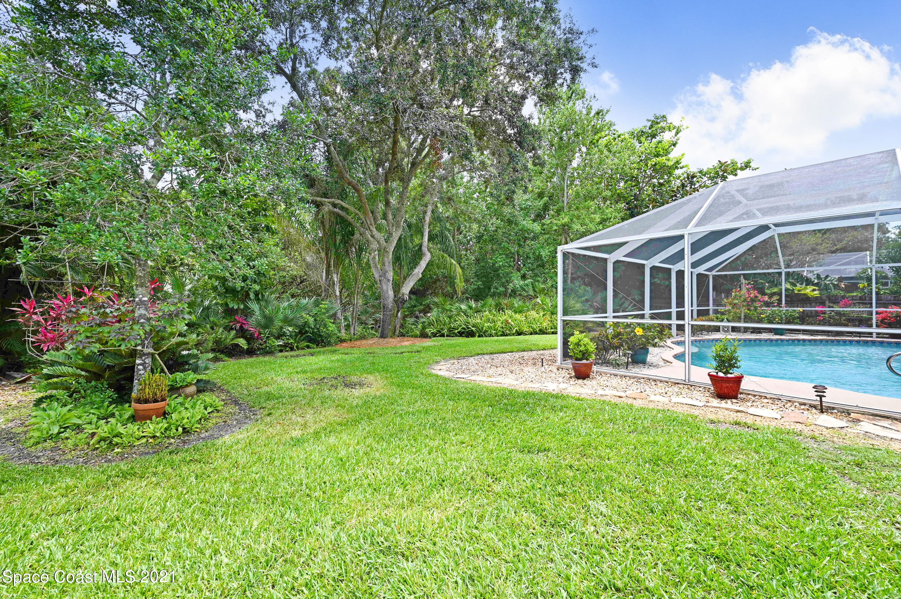 4689 Canard Road Melbourne, FL 32934 - Photo 38 of 49 a view of a house with backyard and sitting area