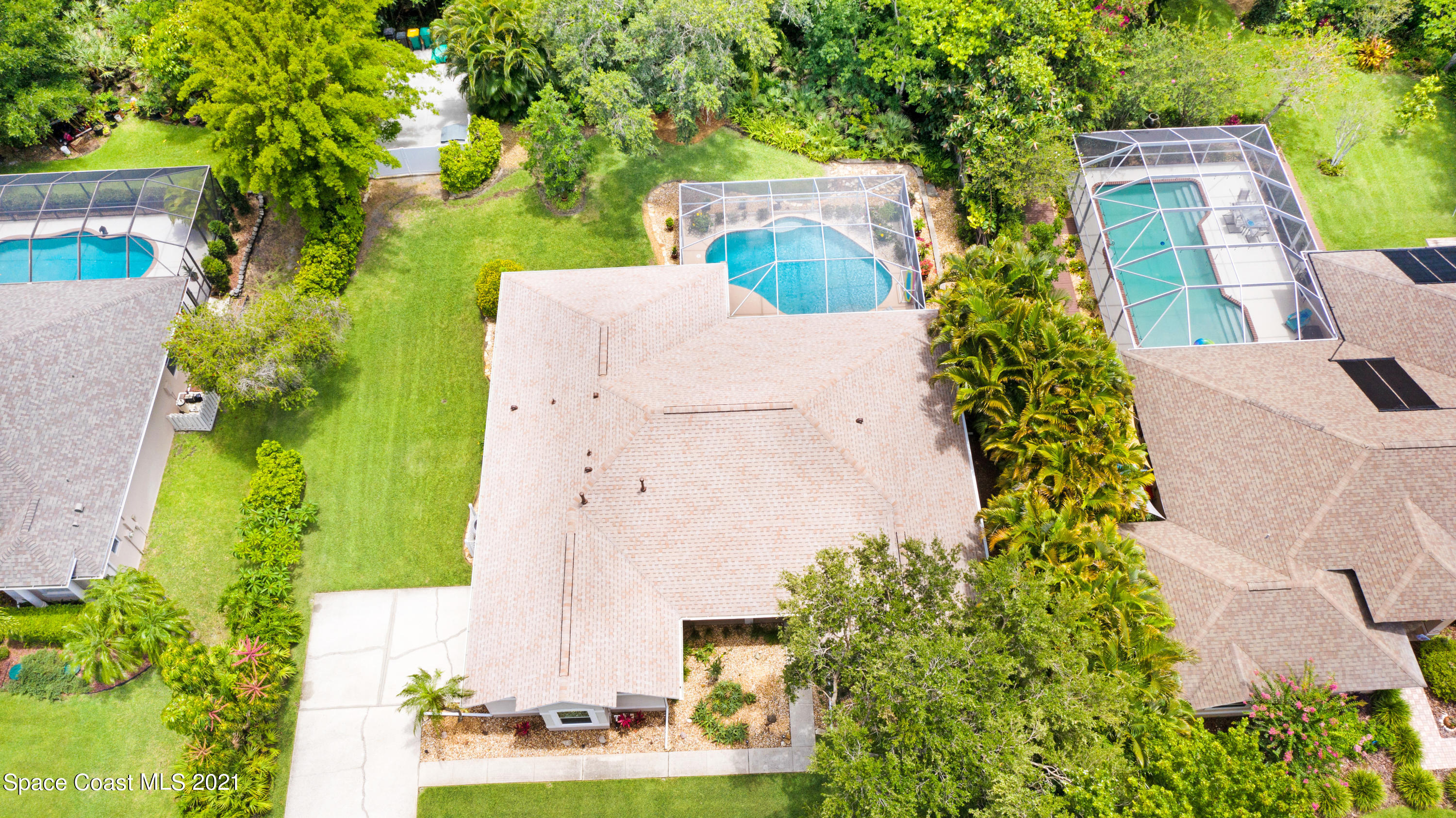 4689 Canard Road Melbourne, FL 32934 - Photo 44 of 49 an aerial view of a house with a yard and garden