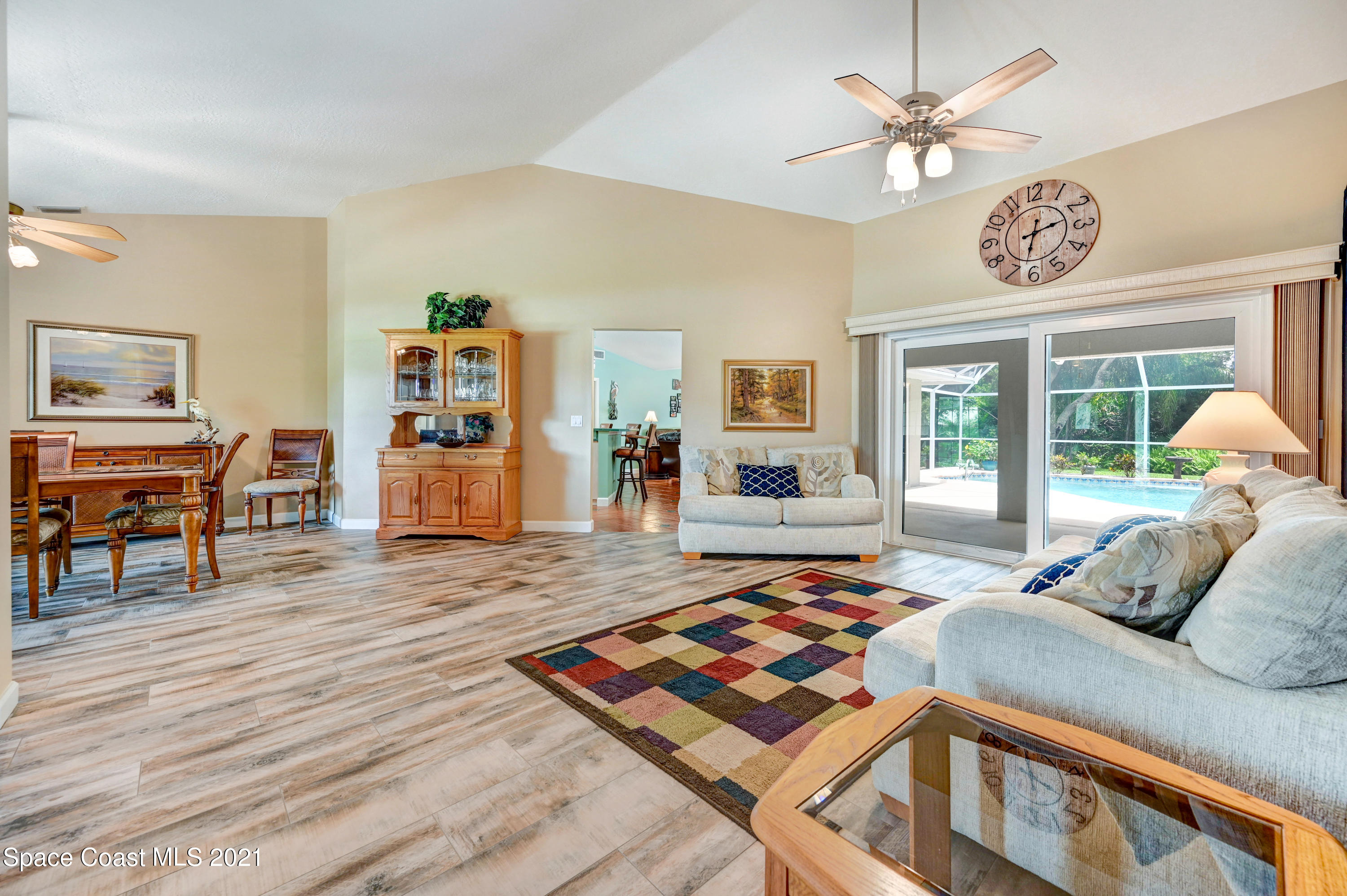4689 Canard Road Melbourne, FL 32934 - Photo 8 of 49 a bedroom with a bed and a table in it