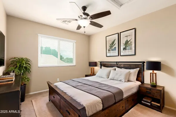 a bedroom with bed and a window