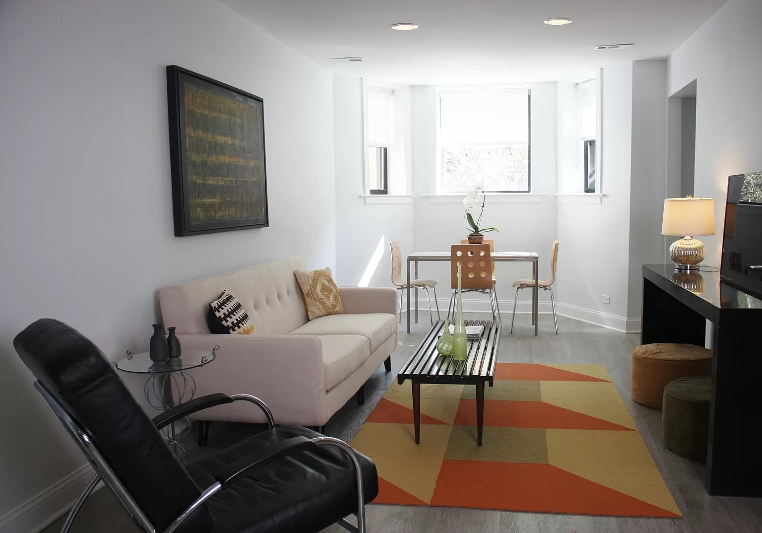 712 West Briar Place Chicago, IL 60657 - Photo 2 of 9 a living room with furniture and a fireplace