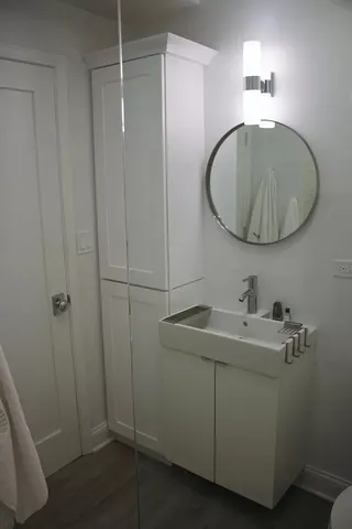 a bathroom with a sink and mirror