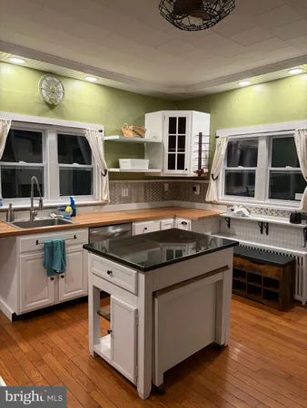 a bedroom with a bed and a dresser in it