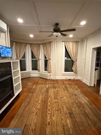 a view of empty room with wooden ceiling