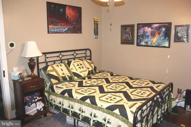 a view of a patio with table and chairs and potted plants