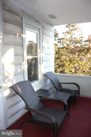 a backyard of a house with outdoor seating