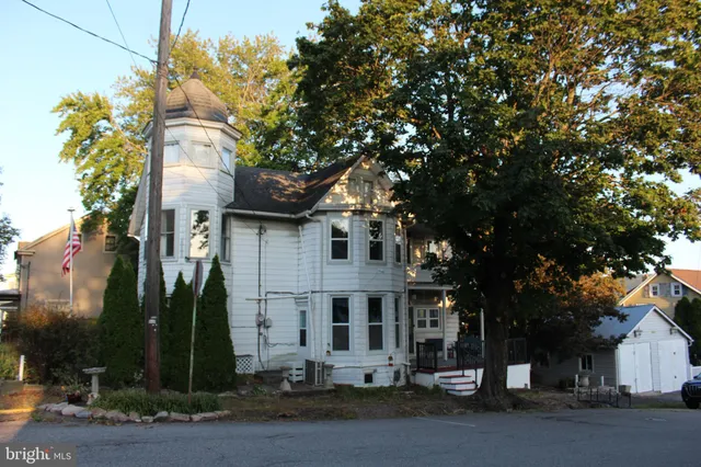 a kitchen with a stove a sink and a refrigerator