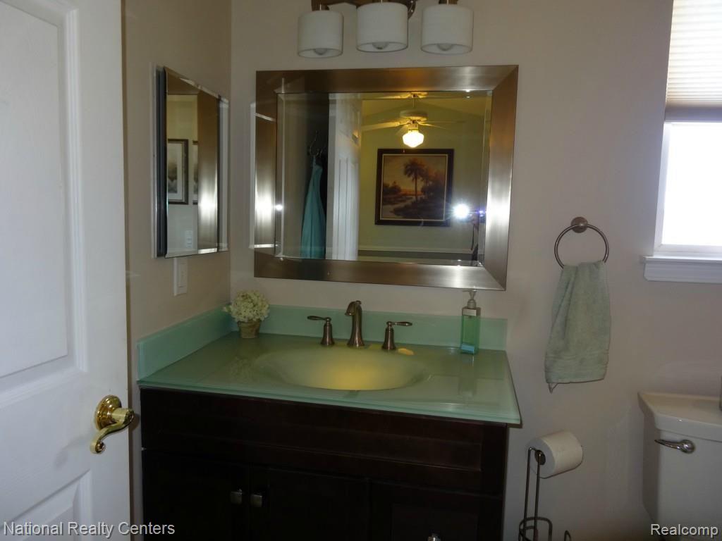 4335 North Ridge Drive Pinckney, MI 48169 - Photo 30 of 42 Green Glass under lit sink!