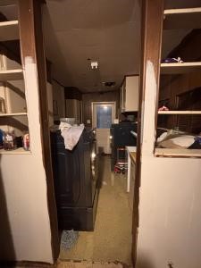 308 Graham Road Kenedy, TX 78119 - Photo 4 of 10 a kitchen with a refrigerator and a stove