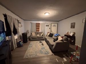 308 Graham Road Kenedy, TX 78119 - Photo 6 of 10 a living room with furniture window and a flat screen tv