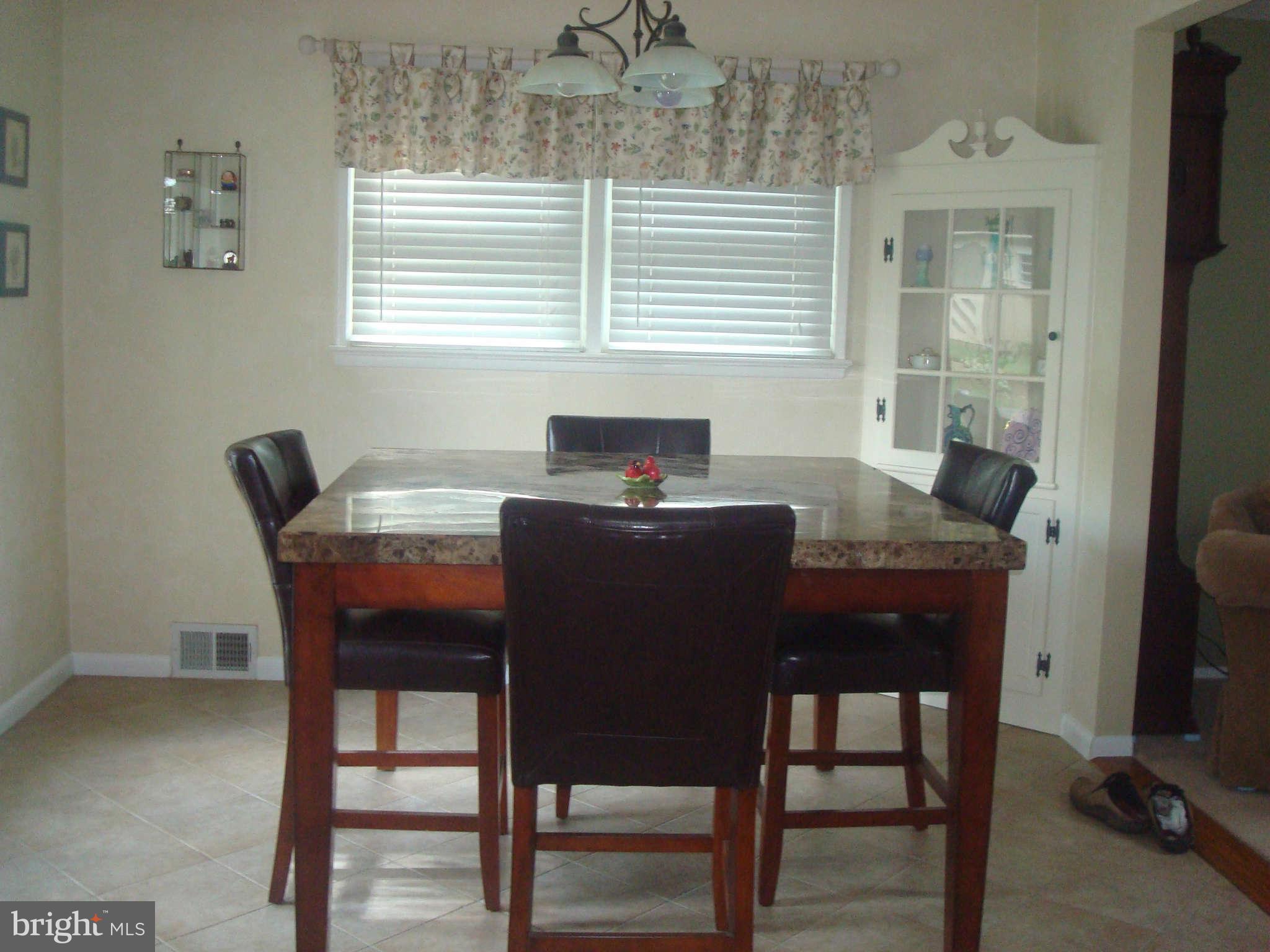 7413 Farnum Street Springfield, VA 22151 - Photo 4 of 17 a table and chairs in a room