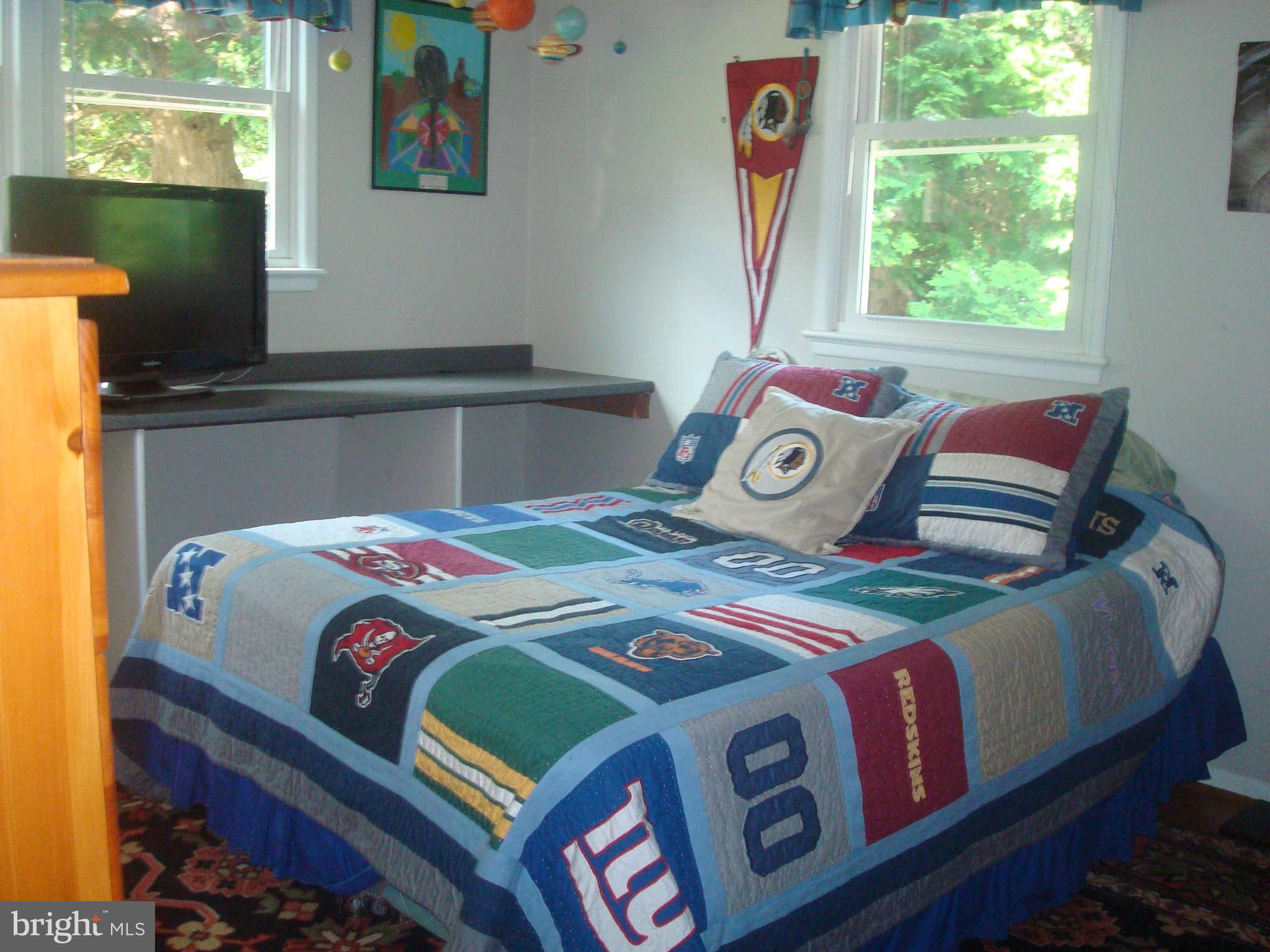 7413 Farnum Street Springfield, VA 22151 - Photo 6 of 17 a bedroom with a bed and a window